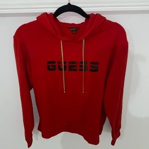 Red Guess hoodie with gold chain strings. Great condition worn once! (Small)